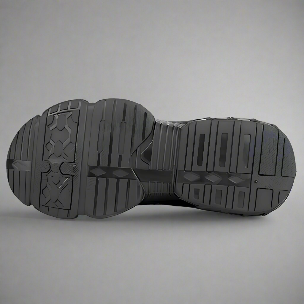 Black sole of a shoe on a gray background